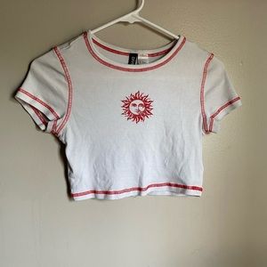 White crop top with red sun design and seams. Brand Divided. Small